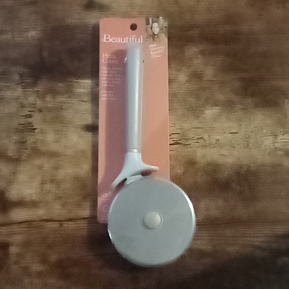 Beautiful by Drew Barrymore pizza cutter